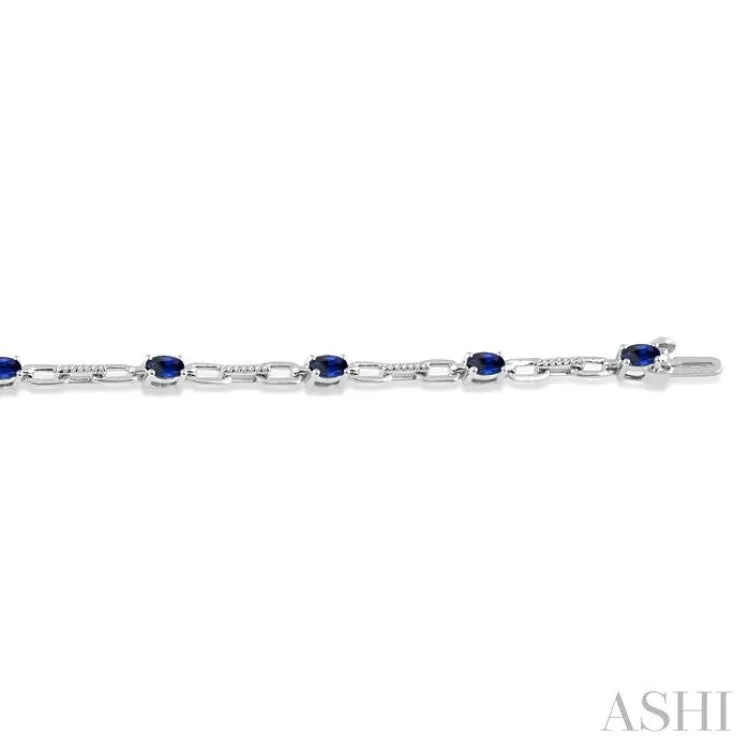 1/6 Ctw Round Cut Diamond & 5x3MM Oval Cut Sapphire Precious Bracelet in 10K White Gold