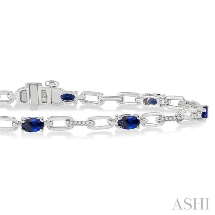 1/6 Ctw Round Cut Diamond & 5x3MM Oval Cut Sapphire Precious Bracelet in 10K White Gold